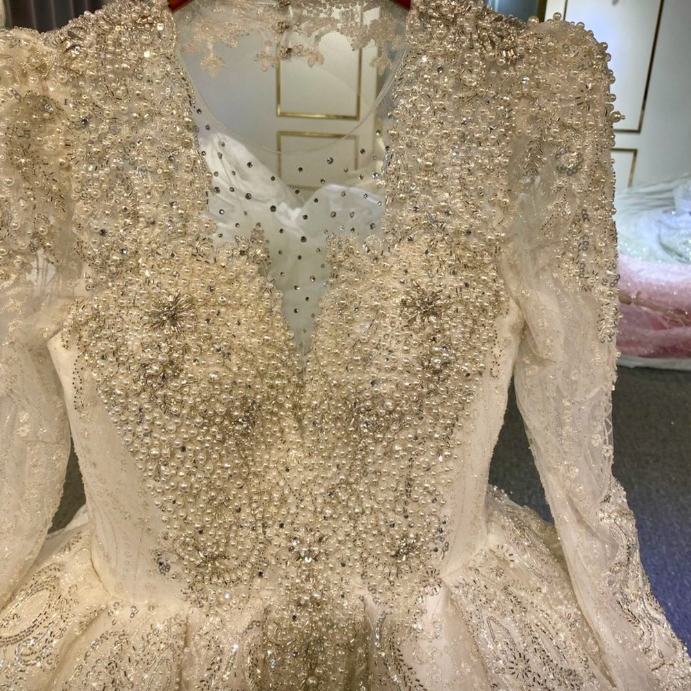 Beautifully designed Amanda Novias pearl and sequin wedding gown never worn